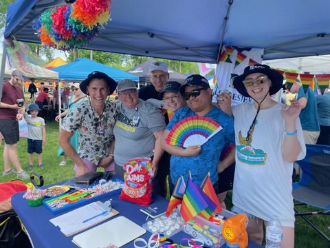 Group of RCTC instructors and students wearing rainbows at the Rochester PRIDE event.